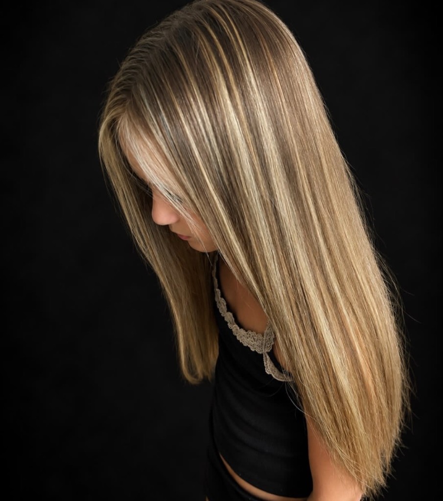 Long dimensional blonde hair with bright ribbons through the lengths
